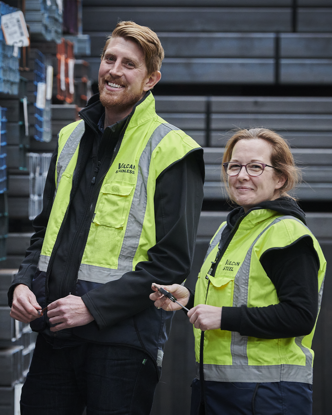 Two smiling Vulcan employees